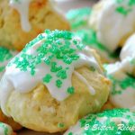 Italian Lemon Cookies with icing and green sparkling crystals on top.