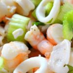 A mixture of cooked Seafood Salad served in a salad bowl.