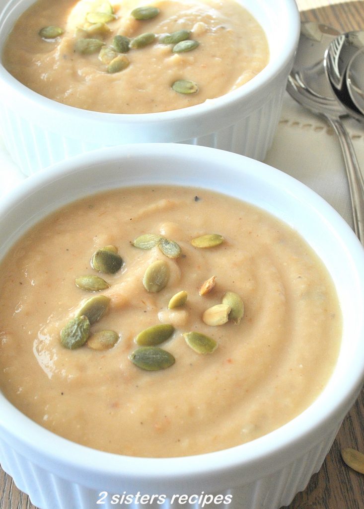 Roasted Garlic Parsnip & White Bean Soup served in a white large ramekin.
