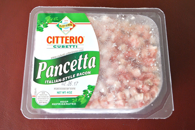 A package of Italian chopped pancetta on the kitchen table.