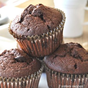 Death by Chocolate Zucchini Muffins . by 2sistersrecipes.com