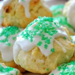 Italian Lemon Cookies with icing and green sprinkles on top.