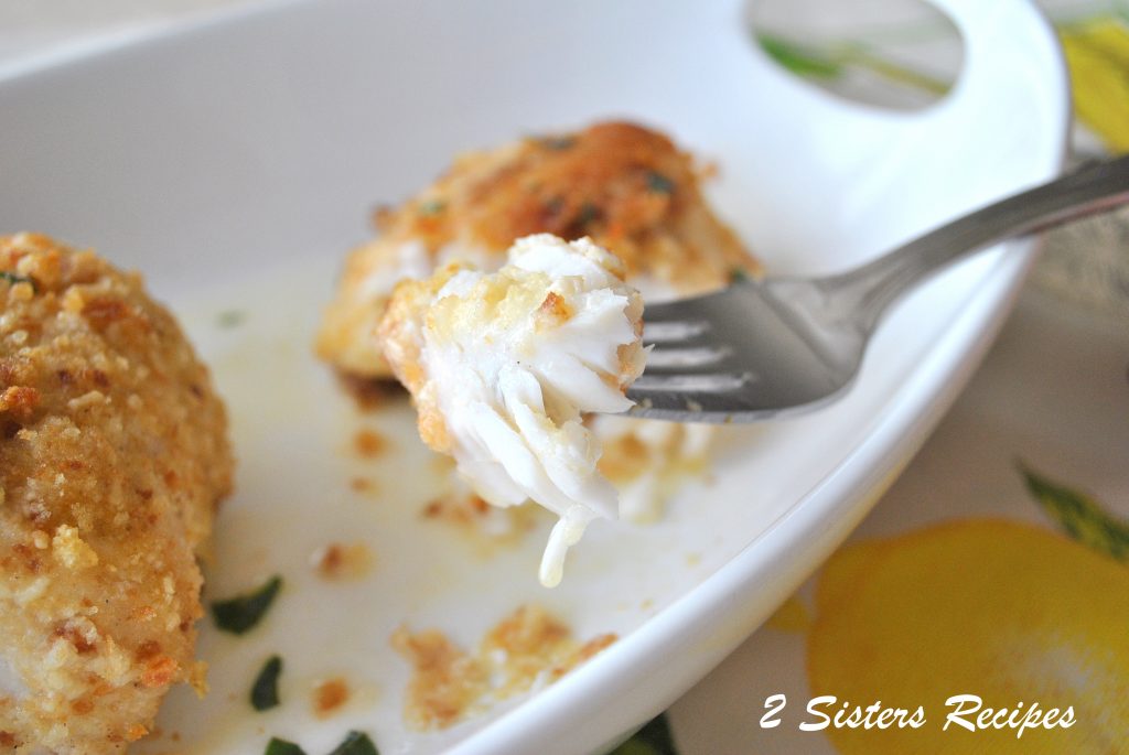 A forkful of baked halibut. by 2sistersrecipes.com 