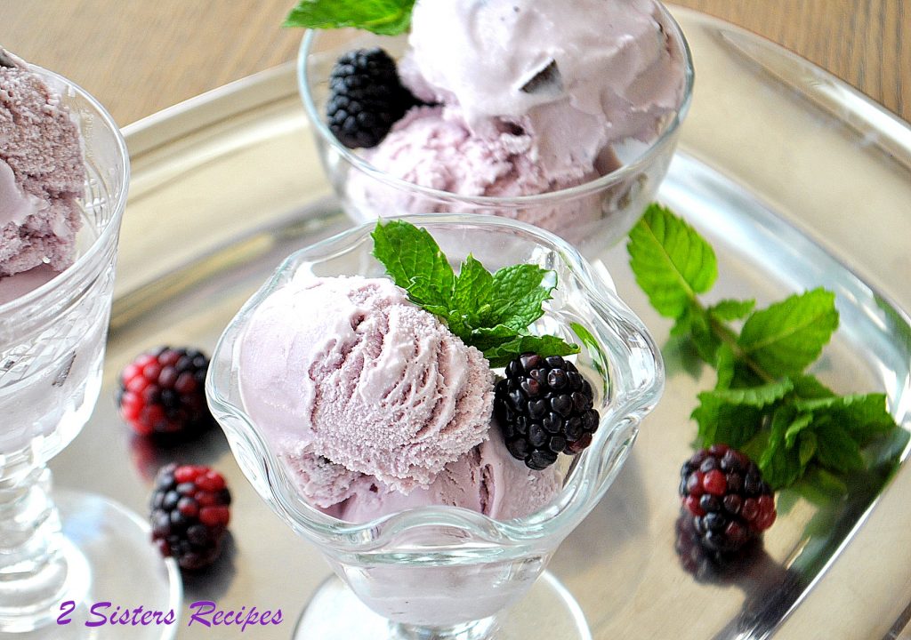 Three glasses filled with blackberry gelato, along with blackberries and fresh mint. by 2sistersrecipes.com 