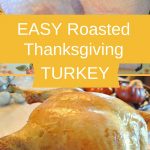 A raw turkey sitting in a roasting rack, and a roasted turkey resting on a wood carving board