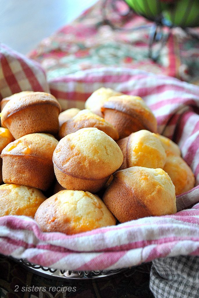  A basket filled with baked mini Biscuits by 2sistersrecipes.com