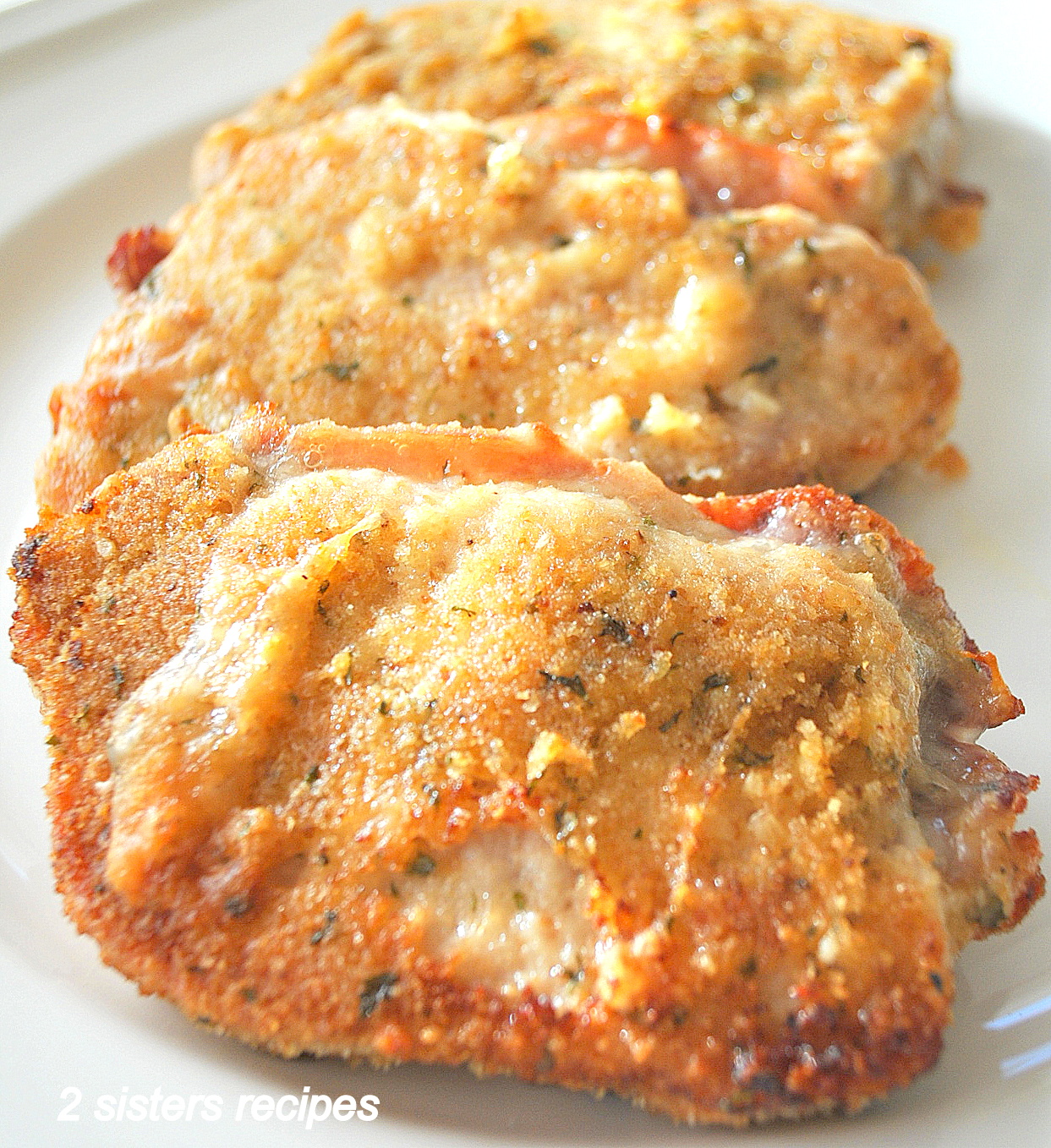 Baked Stuffed Pork Chops by 2sistersrecipes.com