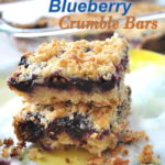 Lemon Blueberry bars are piled on top of each other.