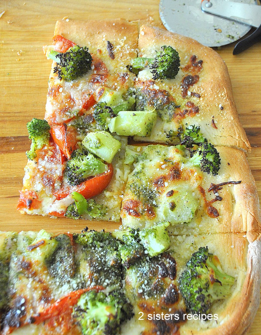 Broccoli Tomato Pesto Pizza by 2sistersrecipes.com
