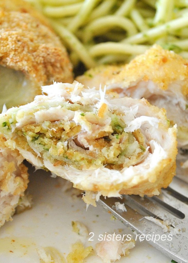 A forkful of filet of flounder rollatini. 