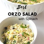 A large white salad bowl filled with orzo pasta, ribbons of spinach and chopped olives,