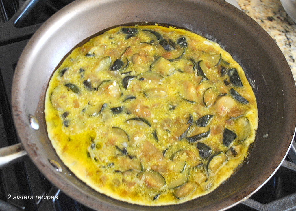 Zucchini Omelet in a skillet by 2sistersrecipes.com 