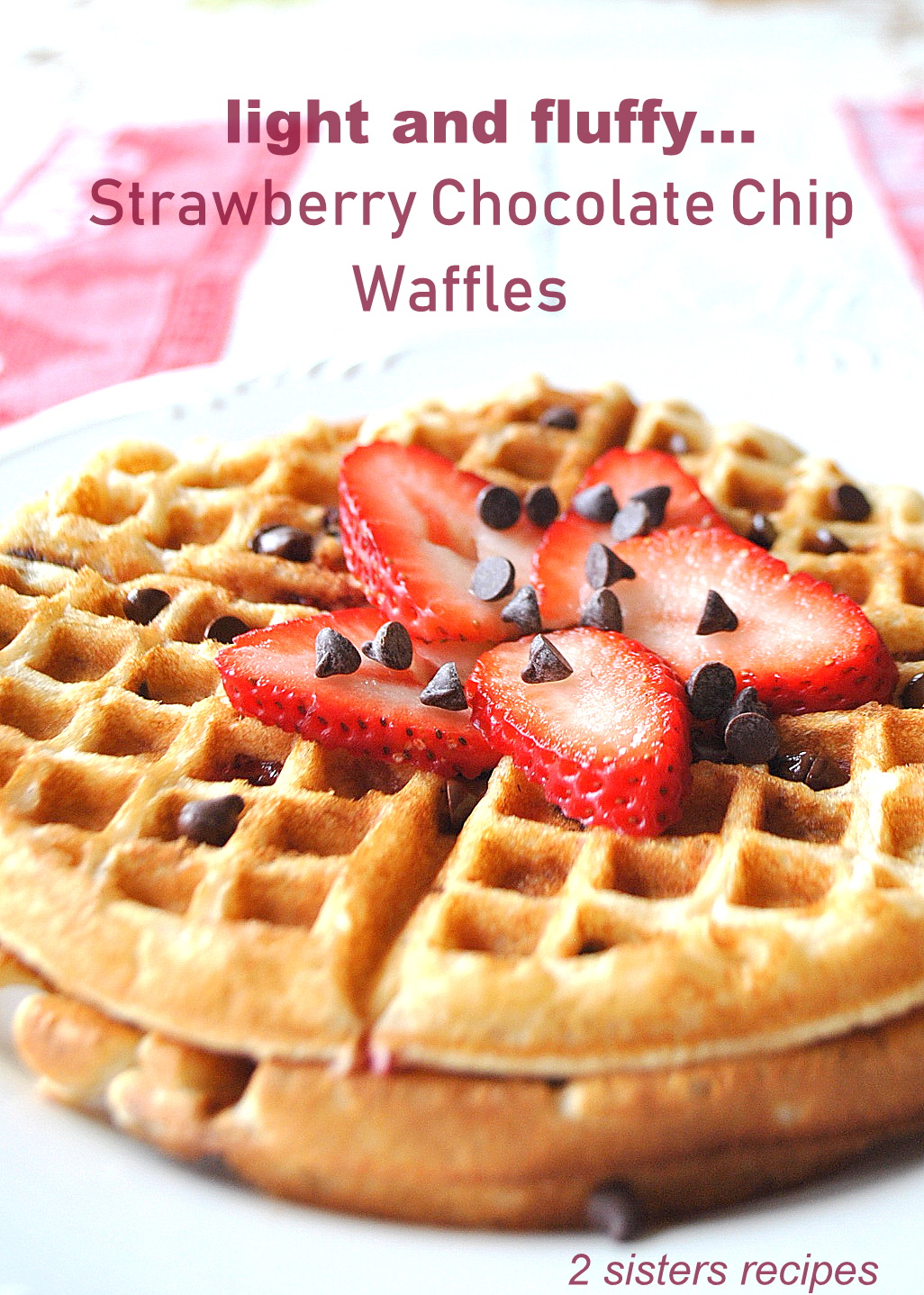 Round shape waffles with mini chocolate chips and sliced strawberries on top.