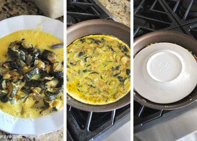 A white plate with raw egg and zucchini mixture, and a skillet simmering the egg mixture, and a white plate placed on top of the omelet inside the skillet.