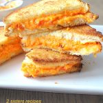 Grilled Pimento Cheese Sandwiches piled on top of each other.