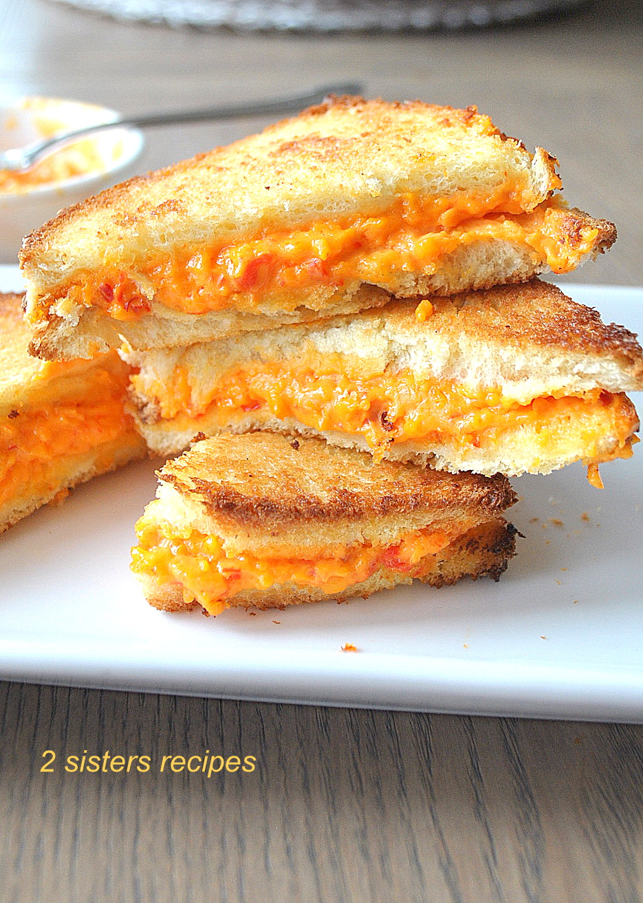 Grilled Pimento Cheese Sandwiches piled on top of each other.