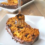 A slice with a fork in it, our Pumpkin Bread filled with chocolate chips.