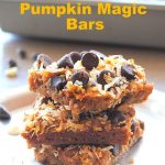 Gluten Free Pumpkin Magic Bars piled on top of one another .