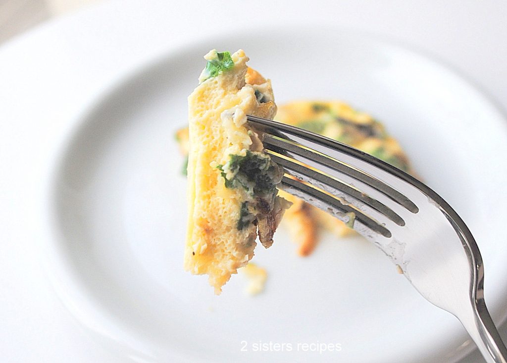 A forkful of the egg and spinach casserole. by 2sistersrecipes.com 