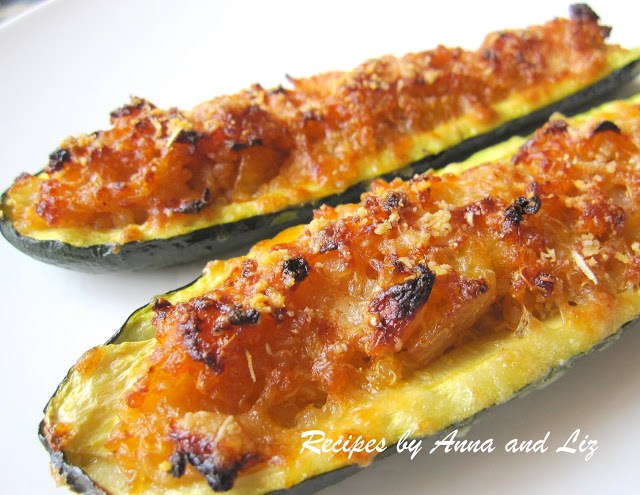 2 zucchini boats stuffed with quinoa and cheese. 