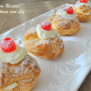 Italian Cream Puff's on a long white serving platter.