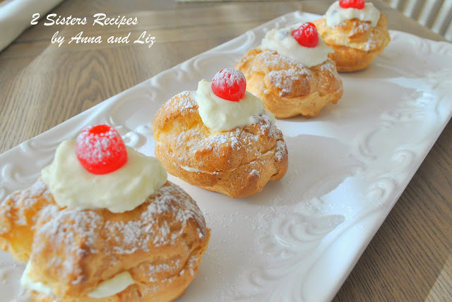 Italian Cream Puff's on a long white serving platter.