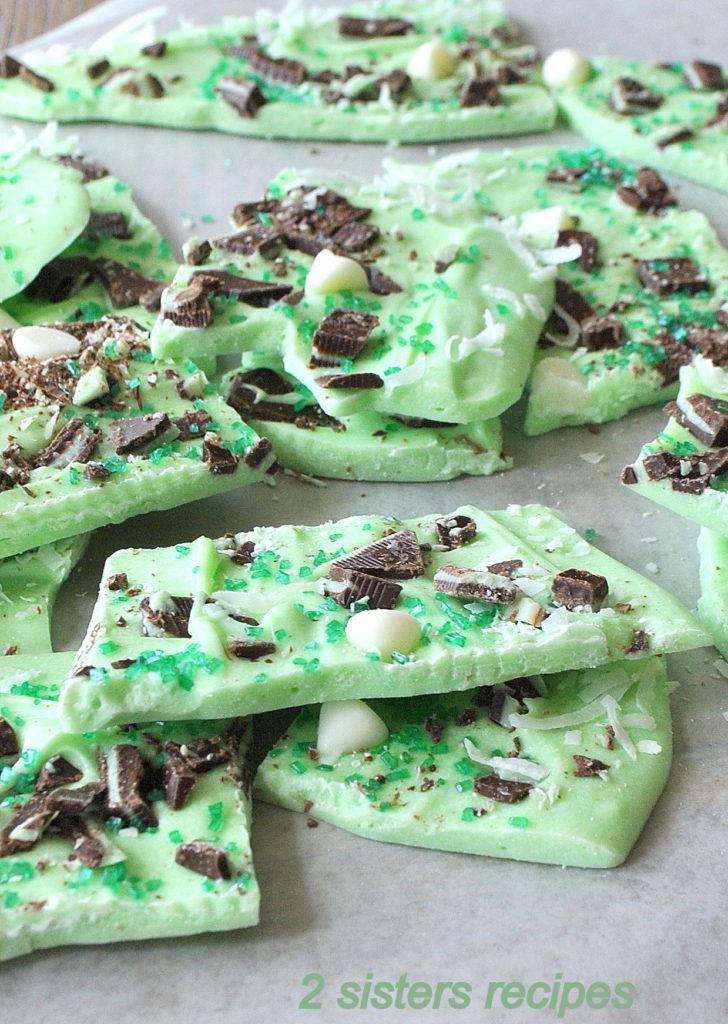 Green Chocolate Bark broken into pieces on the table. by 2sistersrecipes.com 