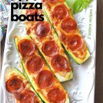 Zucchini Pepperoni Pizza Boats served on a long white platter.