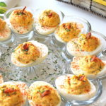 a round dish filled with deviled eggs for an easy Easter dinner recipe.