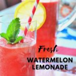 A tall glass filled with watermelon lemonade with a slice of lemon on the rim of glass and red and white stripe straw.