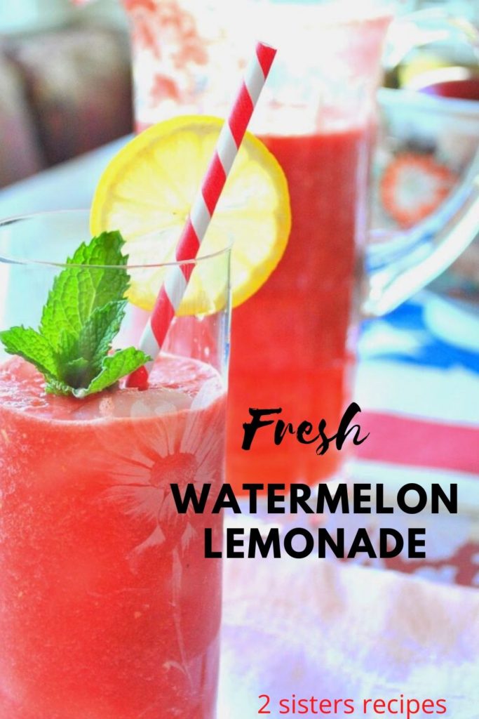 A tall glass filled with watermelon lemonade with a slice of lemon on the rim of glass and red and white stripe straw. 