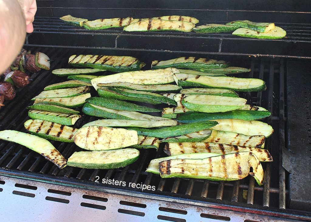  Zucchini is grilled on the barbecue by 2sistersrecipes.com 
