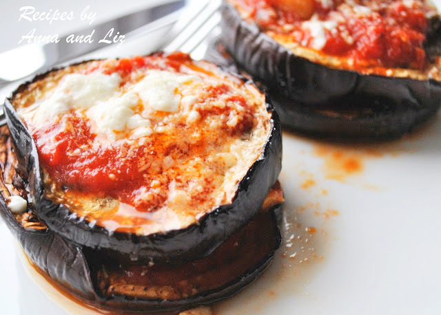 Individual Roasted Eggplant slices topped with tomato sauce and melted cheese. by 2sistersrecipes.com