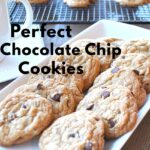 A white platter filled with perfect chocolate chip cookies.