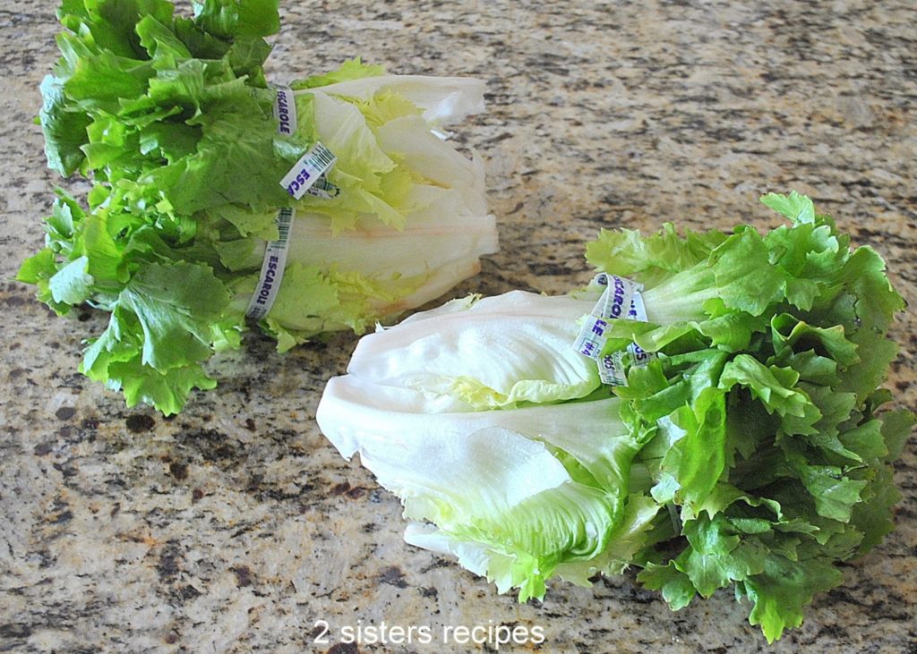 Photo of fresh escarole on the counter. by 2sistersrecipes.com 