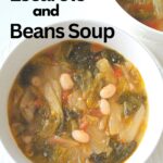 A white soup bowl filled with white beans, escarole and tomatoes in a broth.