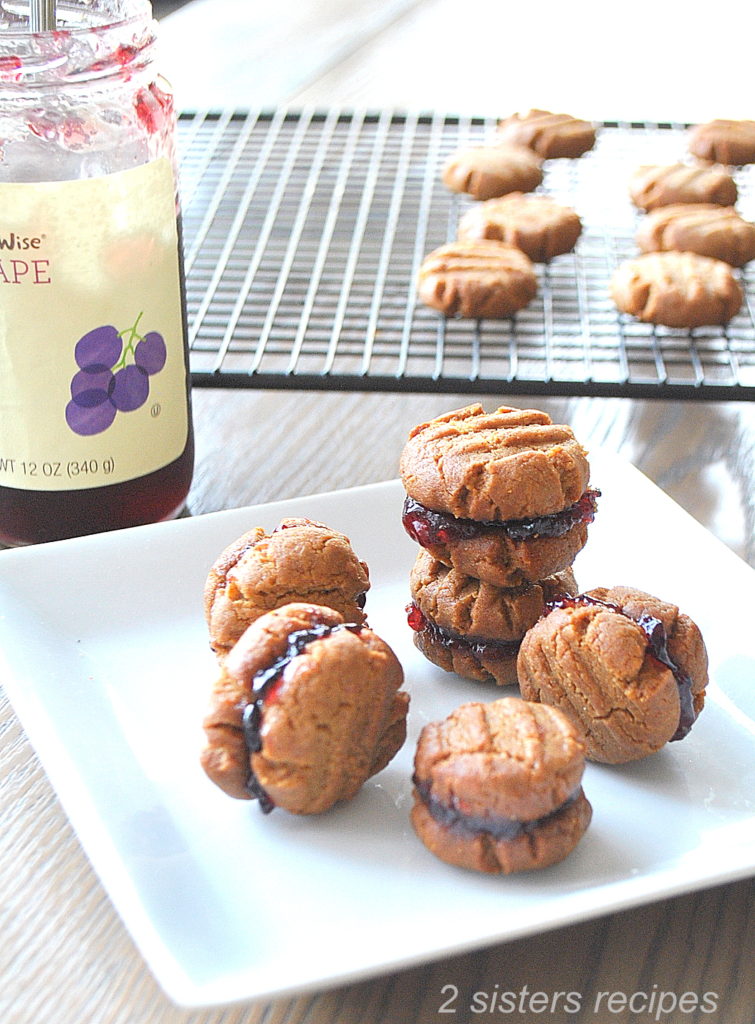 Delicious 5-Ingredient Peanut Butter and Jelly Sandwich Cookies. by 2sistersrecipes.com