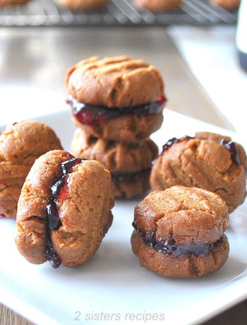 little bite-sized Sandwich Cookies on a plate. by 2sistersrecipes.com