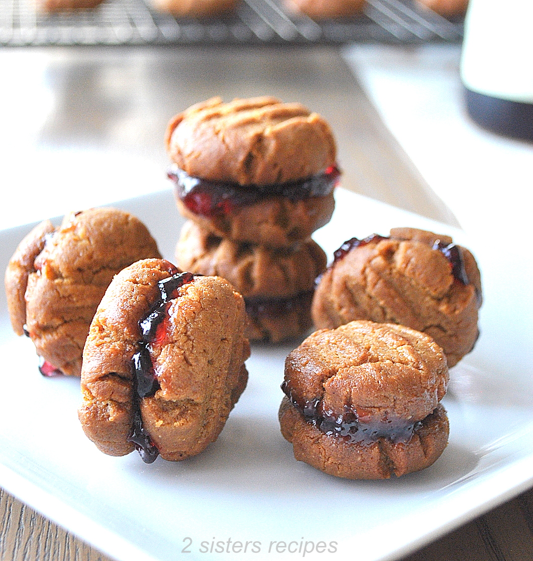 little bite-sized Sandwich Cookies on a plate. by 2sistersrecipes.com