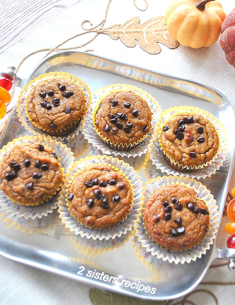 A silver tray displaying 6 pumpkin muffins by 2sistersrecipes.com