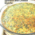 A fully baked Crustless Spinach and Cheese Quiche served in a glass pie dish.