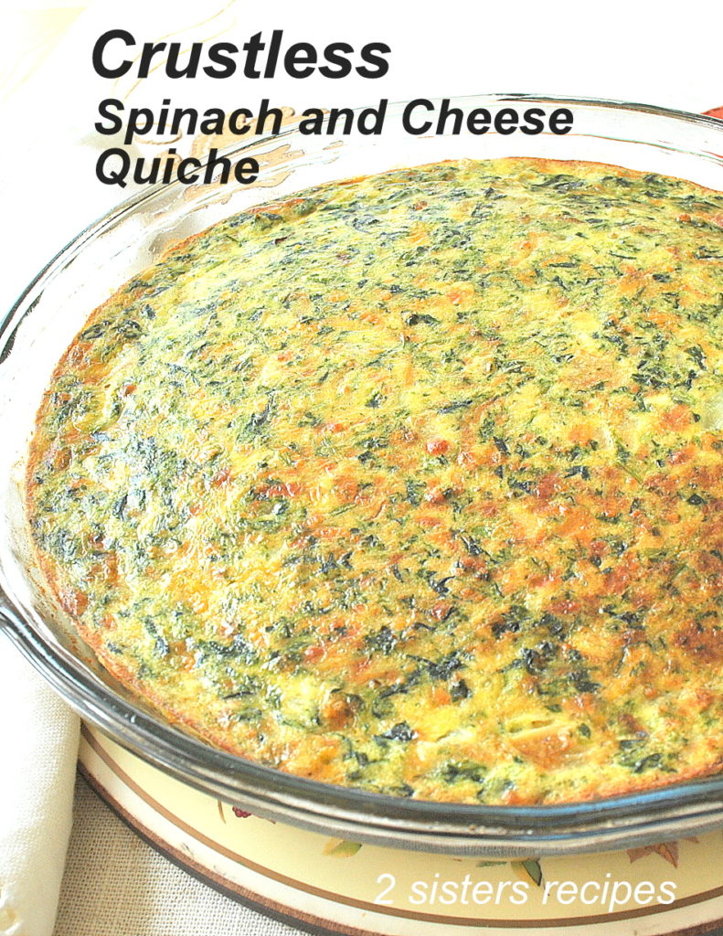 A fully baked Crustless Spinach and Cheese Quiche served in a glass pie dish.