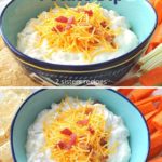 A blue bowl with a creamy dip, topped with shredded cheese and chopped bacon.