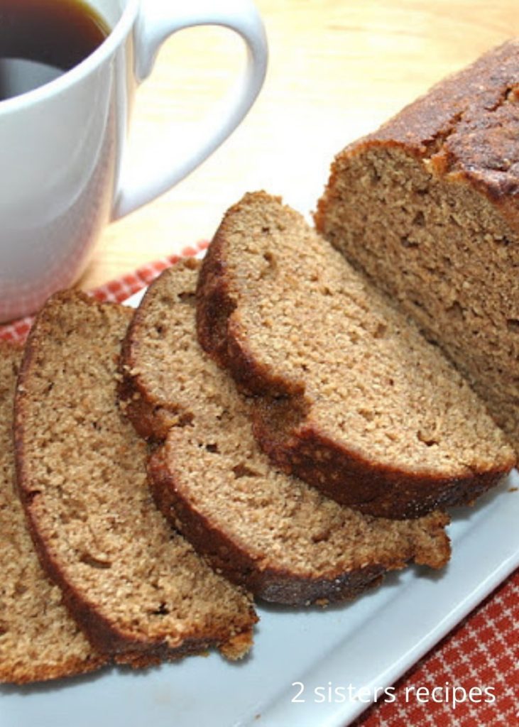 A slice of pumpkin bread served on a white platter. 