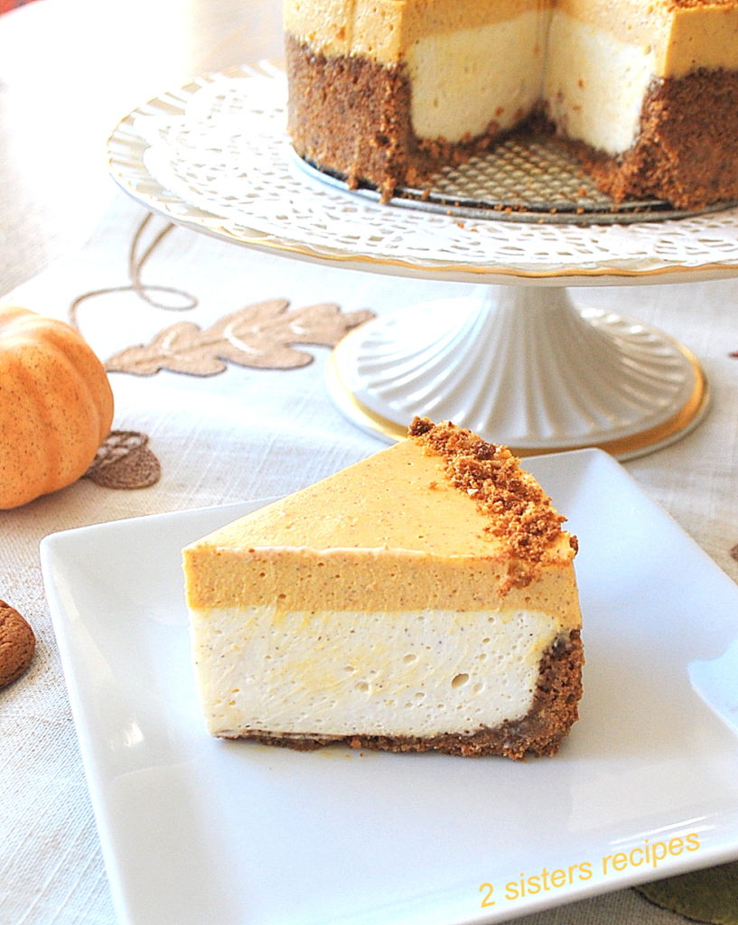 A slice of double layer pumpkin cheesecake served on a white plate.