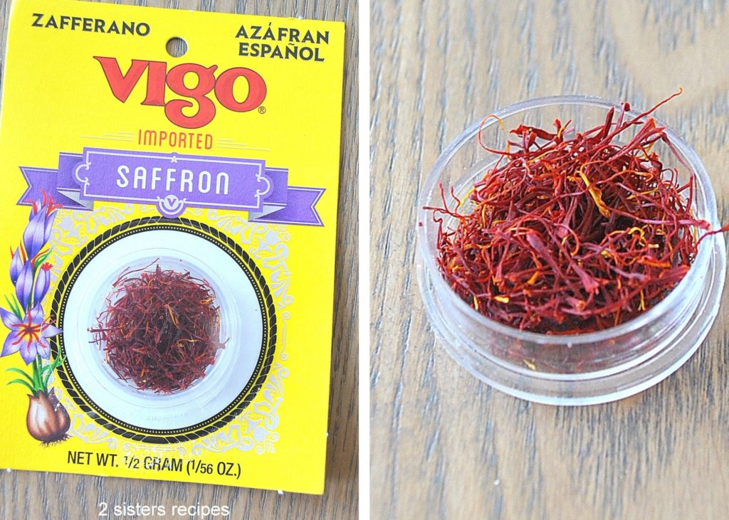 A package of Saffron on the tables along with the open small jar with little bright red threads of saffron.