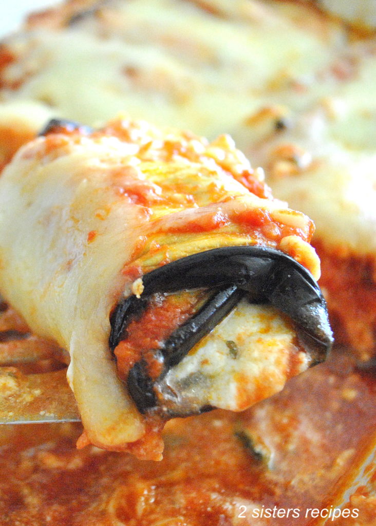 An Eggplant rolled up and stuffed with ricotta cheese in the center.