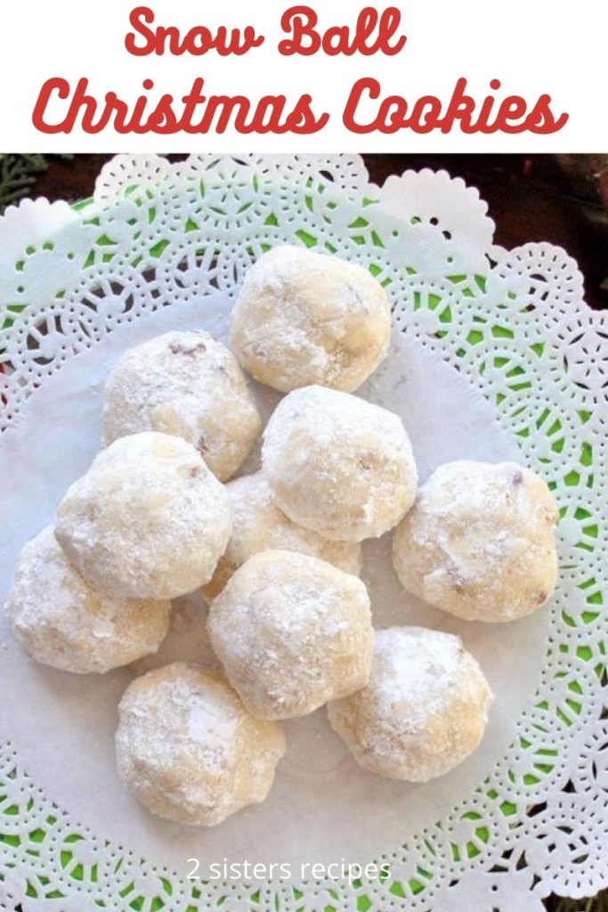 Round cookies covered in powdered sugar served on a white doily.
