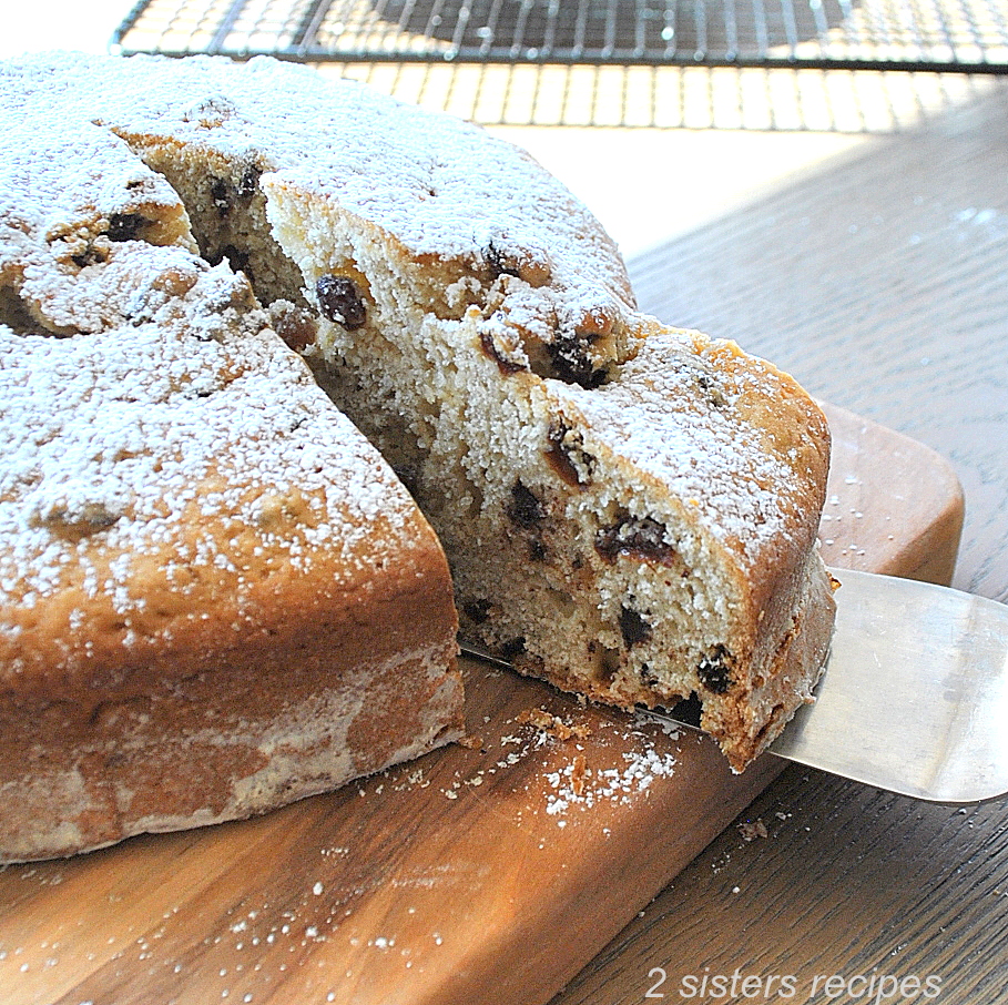 A slice of Irish soda bread with chocolate chips inside.