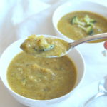 A spoonful of pureed broccoli zucchini soup.